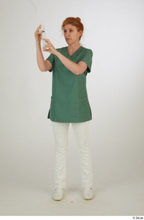 Photos Daya Jones Nurse Pose 1 preparing a jab standing…